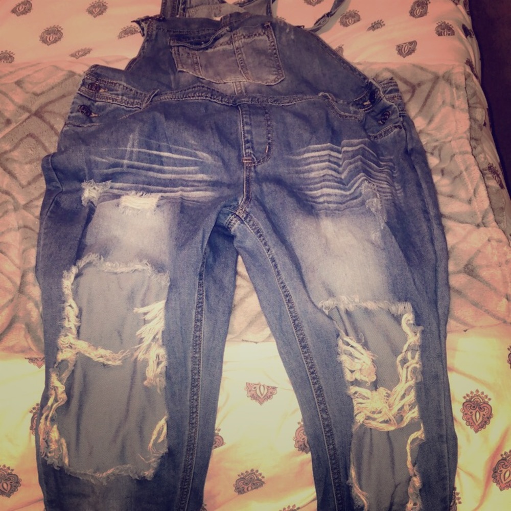 Destroyed denim overalls